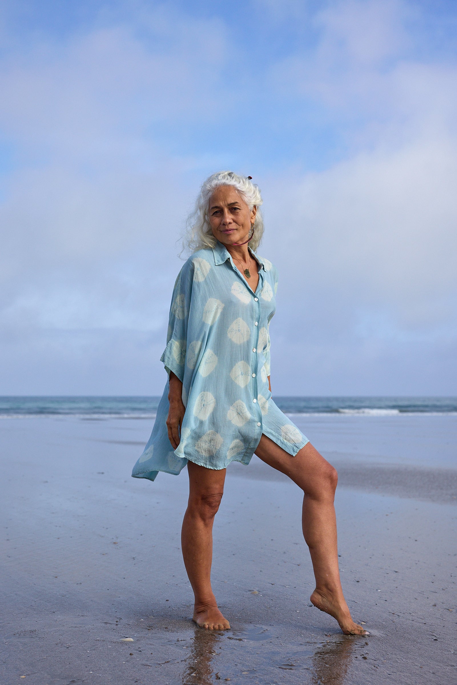 Model wearing the Chico Shirt in Aqua Kina, plant-dyed organic French batiste cotton by Sassa Moon.