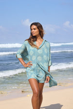 Model wearing the Chico Shirt in Aqua Kina, plant-dyed organic French batiste cotton by Sassa Moon.